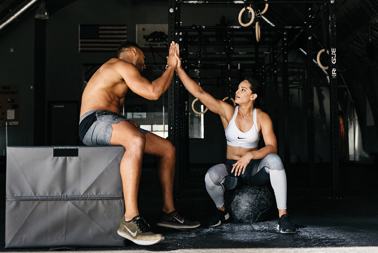 Fit Man And Woman High Five