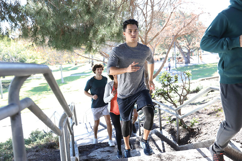 Group Running Up Steps