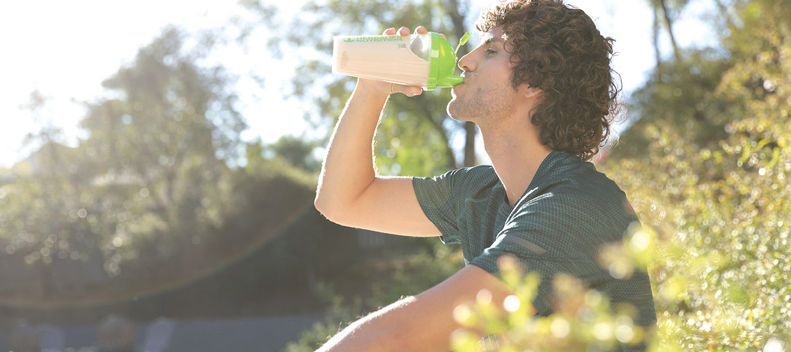 Man Sat Down Drinking A Herbalife Nutrition Shake