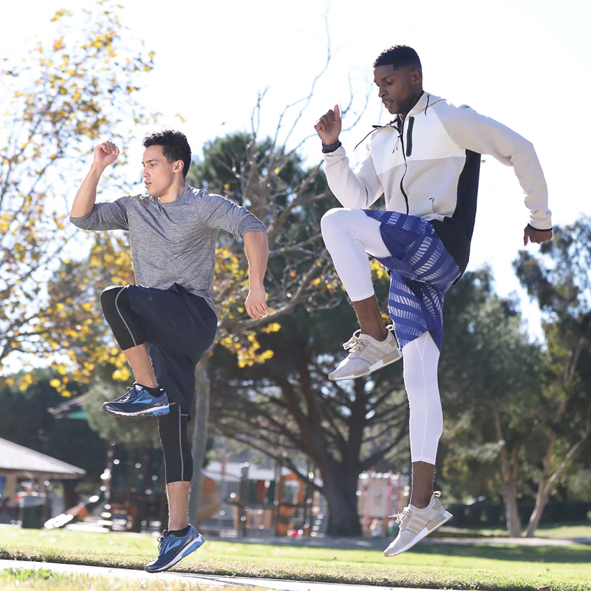 Men Doing High Knees Exercise In Park