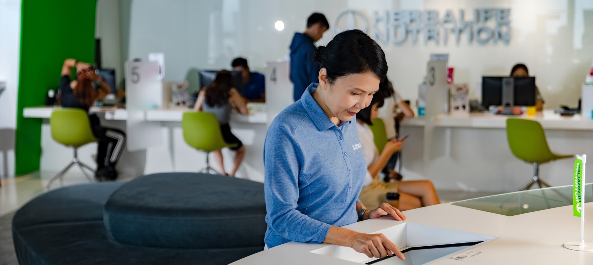 About Herbalife_Woman Using Touch Screen